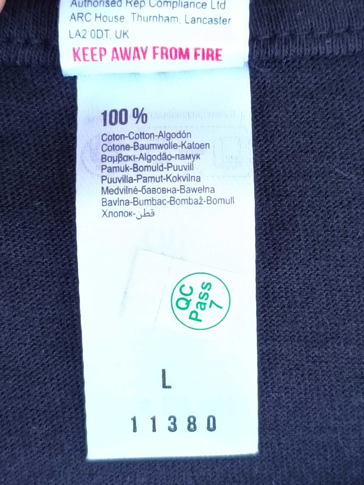 100% cotton label on Ignis Veritas shirt